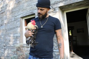 Abz on the Farm - holding Fernando the cockerel. C) Tin Can Island